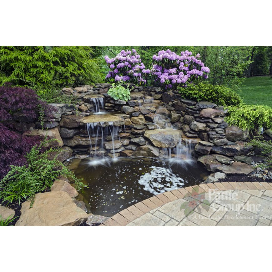 Waterfall and Pond surrounded by Rock