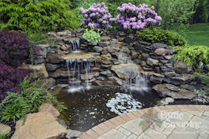 Waterfall and Pond surrounded by Rock