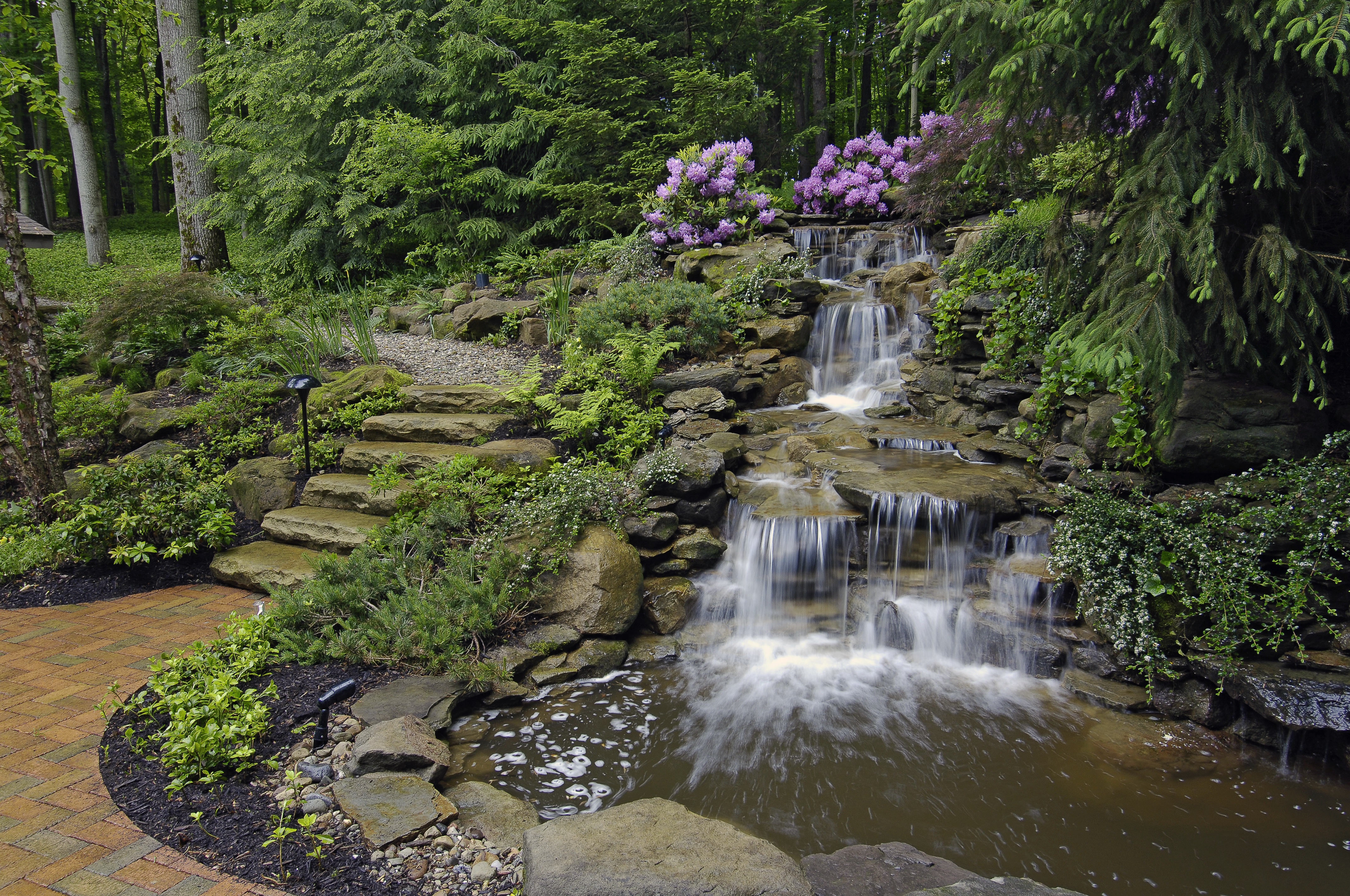 A pond with a waterfall